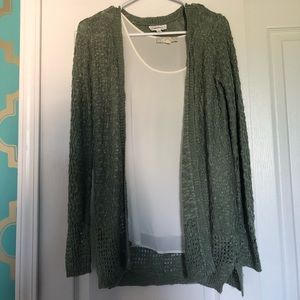 A cardigan with silk tank top.